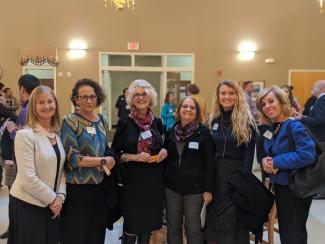 Women standing together at the All Partner Meetup