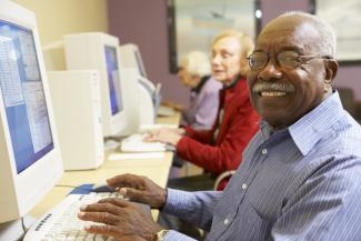 Man sitting in front of a computer